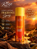Rizz Parfums Fire Dust 200ml luxury perfumed deodorant body spray canister standing on rugged volcanic rocks against a blazing golden sunset backdrop.