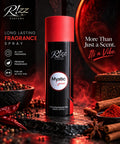 Rizz Parfums Mystic Spice 200ml luxury perfumed deodorant body spray canister standing on wet volcanic rock flanked by red chillies, black peppercorns, and cinnamon sticks.